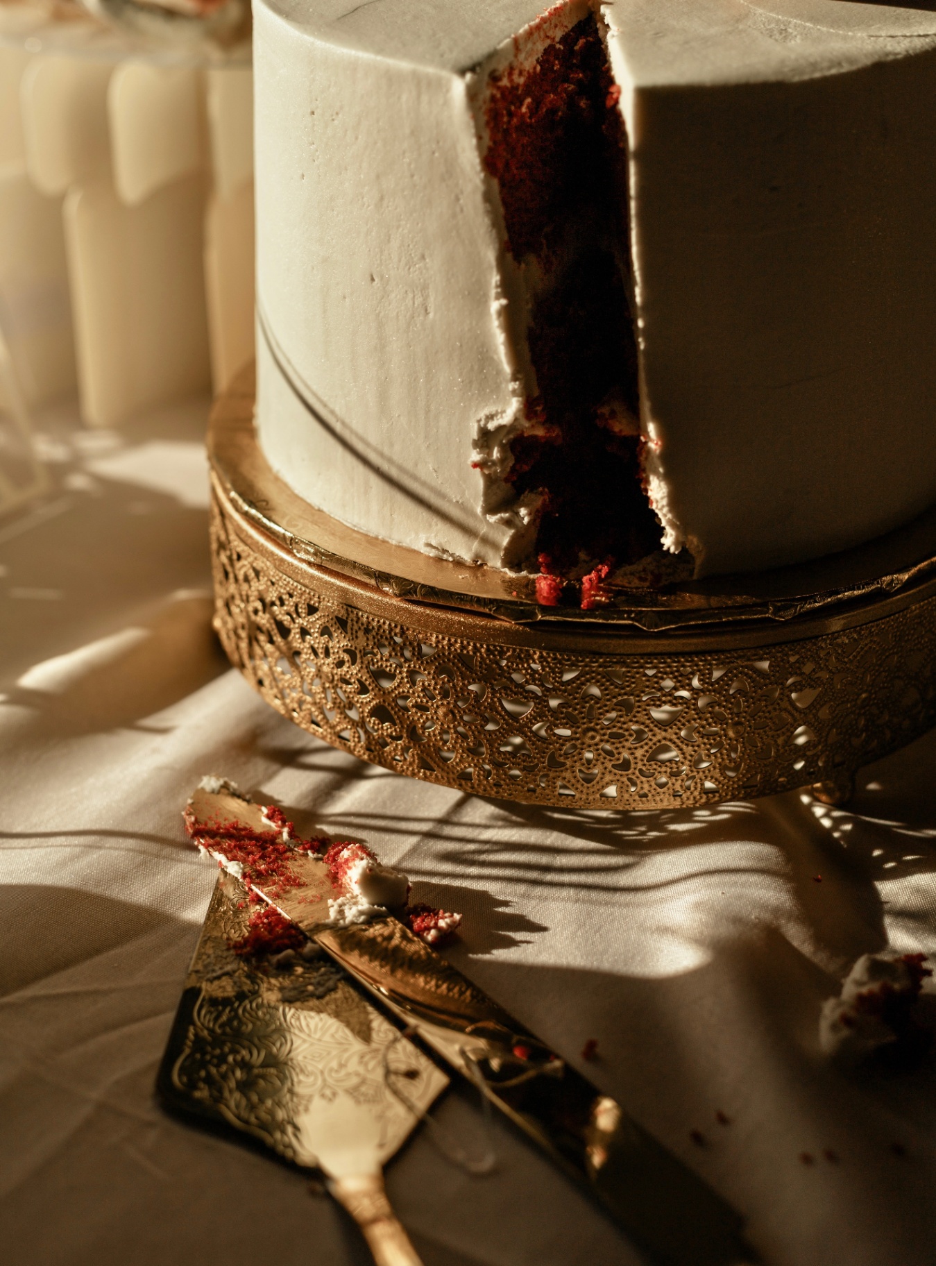 Red velvet wedding cake on a gold stand