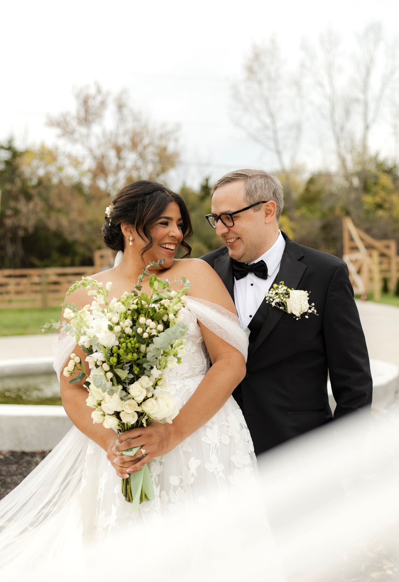 Bride and groom laughing together
